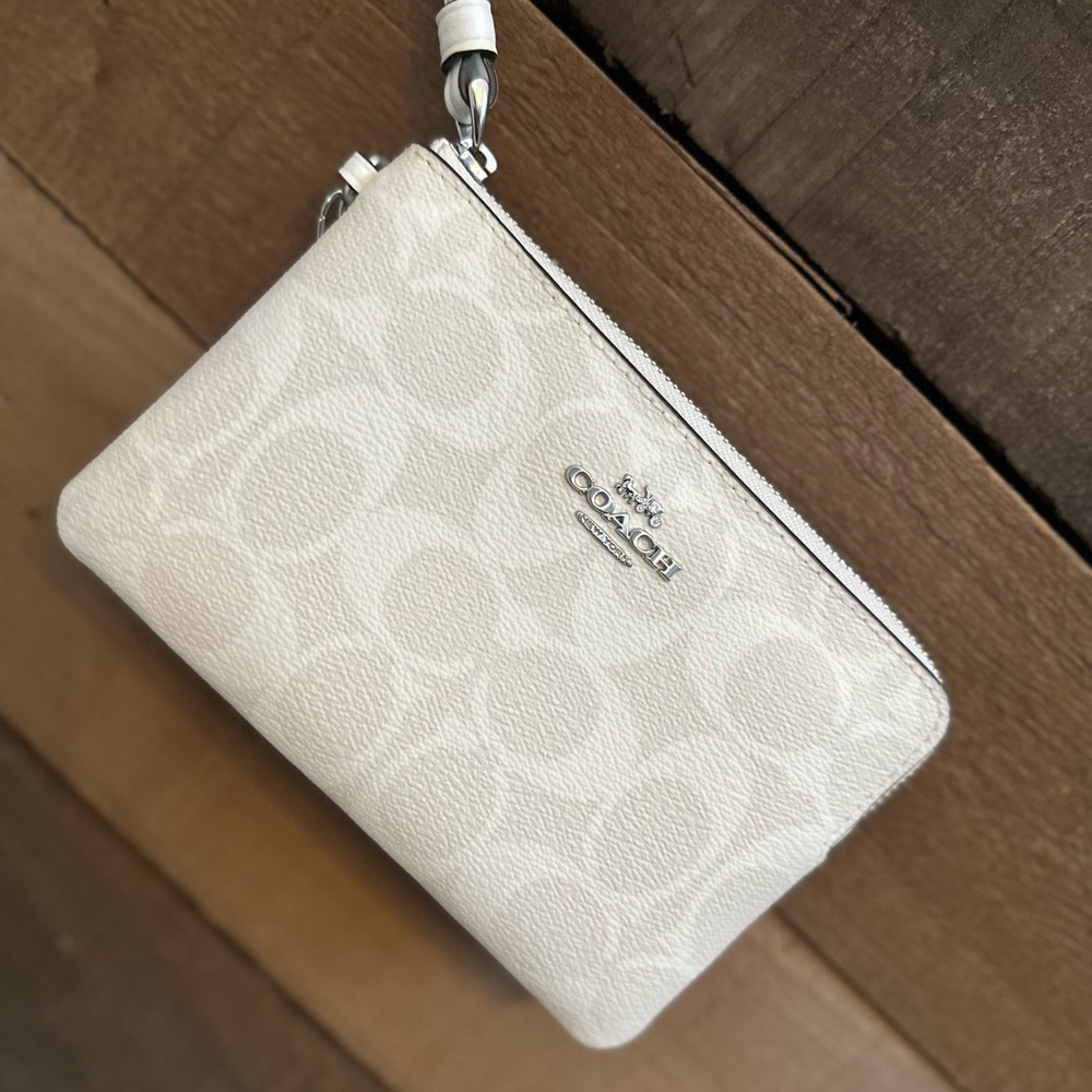 Coach wristlet with snowflake charm